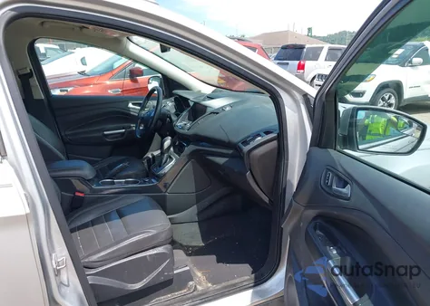 2014 Ford Escape Titanium z USA, uszkodzony, nr VIN 1FMCU9J90EUB13882